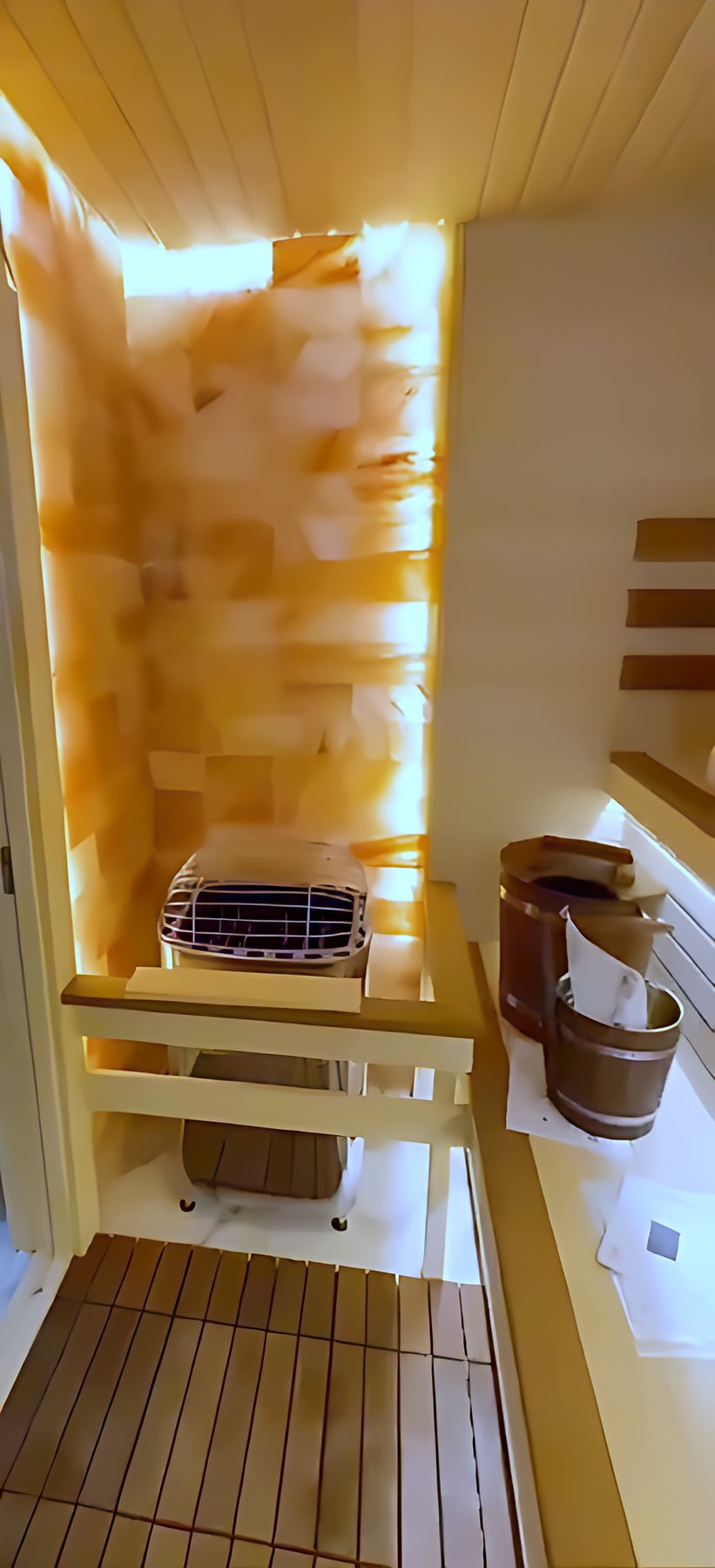 Sauna heater beside the illuminated salt wall