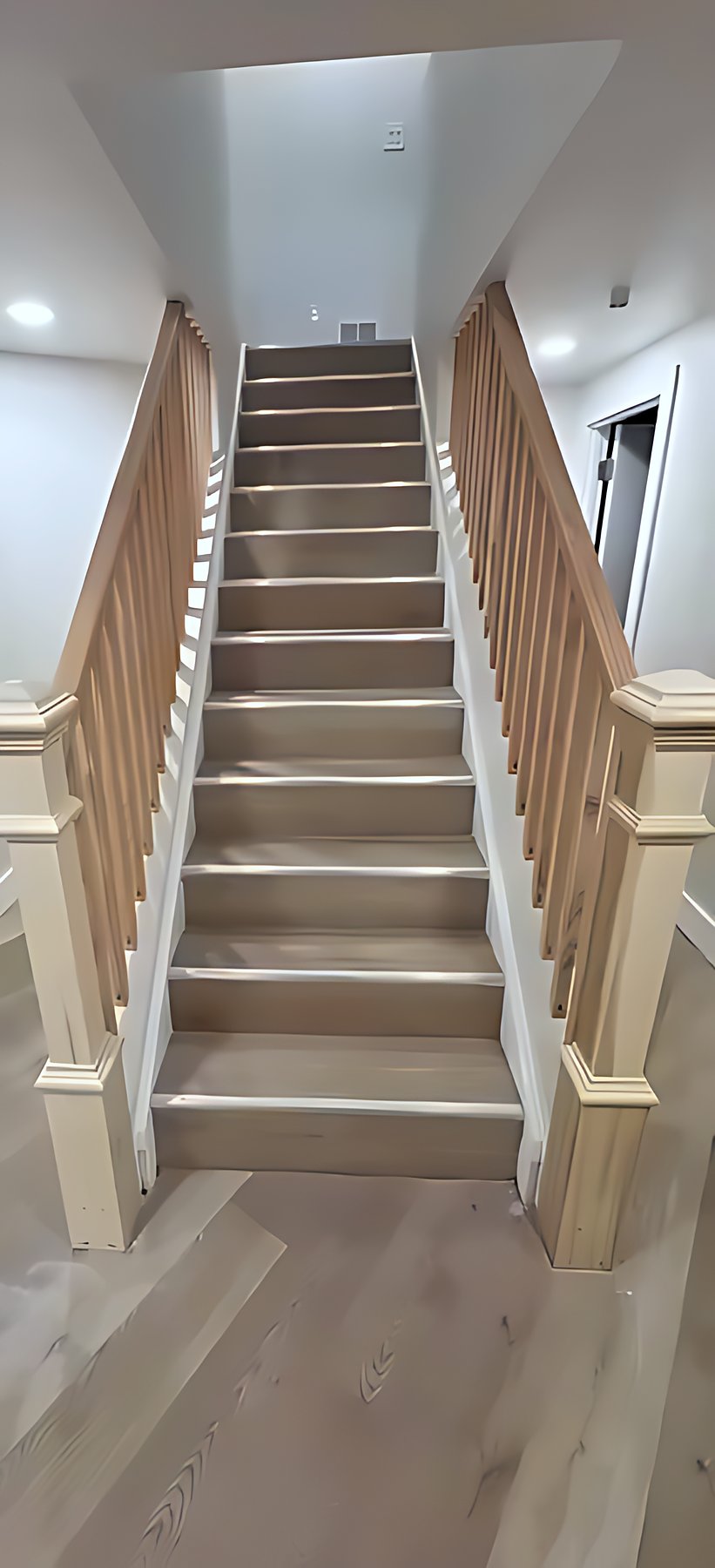 Staircase with oak newel posts and painted risers